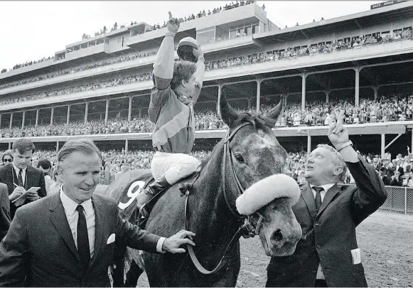  ??  ?? Jockey Bob Ussery, owner Peter Fuller, left, and trainer Louis C. Cavalaris Jr. celebrate with Dancer’s Image in May 1968 at the Kentucky Derby. THE ASSOCIATED PRESS/FILES