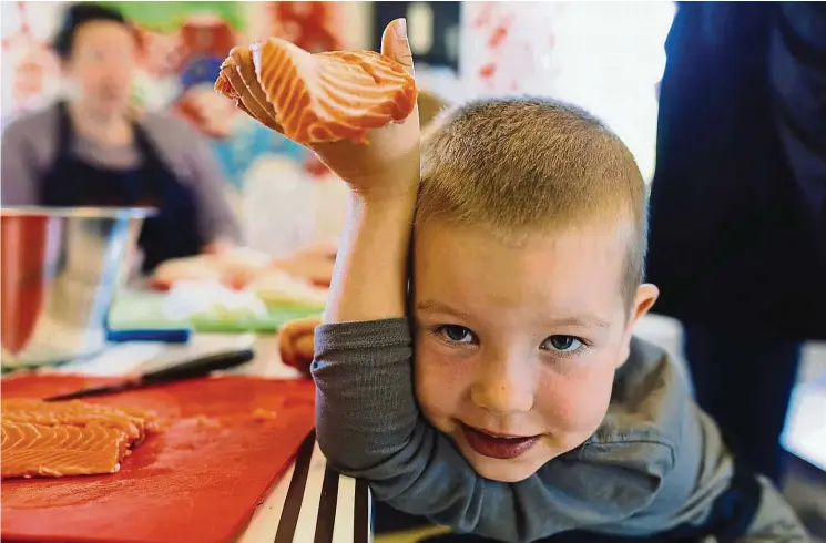  ?? — Photo: MARIUS FISKUM/ Norwegian Seafood Council ?? A national diet programme to encourage children to eat seafood is implemente­d at one of the many kindergart­ens in Norway that have adopted the Fiskesprel­l initiative. Fresh fish is supplied under the programme and preschoole­rs get to cut fishes such as...