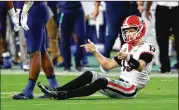  ?? CURTIS COMPTON/AJC ?? Stetson Bennett (13) isn’t the first Georgia QB subjected to second-guessing. Jake Fromm had detractors when he beat out Justin Fields for the job.