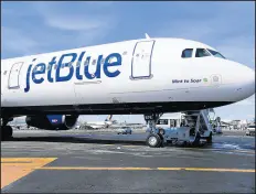  ?? SETH WENIG/AP 2017 ?? JetBlue said it bought the posters from a third party. Above, a JetBlue airplane at New York’s Kennedy Airport.