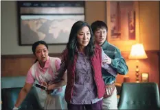  ?? Allyson Riggs/A24 / TNS ?? From left, Stephanie Hsu, Michelle Yeoh and Ke Huy Quan in “Everything Everywhere All at Once.”