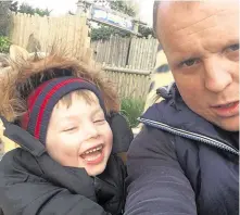  ??  ?? The temporary headstone marking Ollie Jones’ grave. Right, the youngster with his dad Lloyd