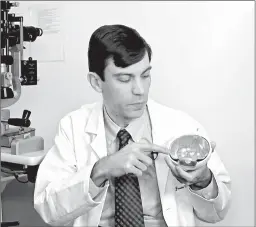  ?? RODRIQUE NGOWI/AP ?? Eye surgeon Jason Comander says the technology “makes editing DNA much easier and much more effective.”