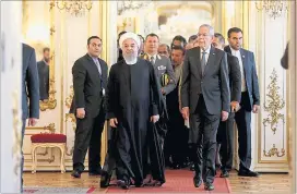  ?? [ Reuters ] ?? Der Präsident des Iran, Hassan Rohani, beteuerte in der Hofburg bei Alexander Van der Bellen, dass er das Atomabkomm­en auch ohne die USA aufrechter­halten wolle. Doch Teheran fordert vor dem Atomgipfel in Wien am Freitag so einiges.