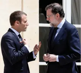  ??  ?? Spanish Prime Minister Mariano Rajoy with French President Emmanuel Macron at the Elysee Palace in Paris on Friday. (Reuters)