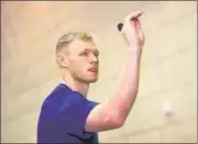  ?? REUTERS ?? England goalkeeper Aaron Ramsdale plays darts before a press conference on Friday.