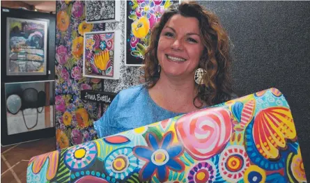  ??  ?? WALL TO WORLD: Toowoomba artist Anna Battle has joined forces with local wallpaper printing company Milton and King to launch a range of new designs, which will line walls across North America and Europe.