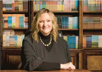  ?? GABRIEL MCCURDY/THE NEW YORK TIMES ?? Karen Kingsbury sits March 15 in Tennessee with copies of her books behind her.