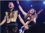 ?? SUBMITTED ?? Bruce Dickinson, left, and Steve Harris rock during an Iron Maiden show. The heavy-metal act is a first-time Rock & Roll Hall of Fame nominee.
