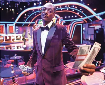  ?? ROBERT HANASHIRO, USA TODAY ?? Would you take $25,000 from this man? Snoop Dogg hosts TBS’ 21st-century The Joker’s Wild.