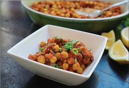  ?? GRETCHEN MCKAY — PITTSBURGH POST-GAZETTE/TNS ?? This easy and nutritious vegetarian chana masala is made with chickpeas, tomatoes and spices in one pot.