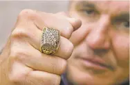  ?? DAN PELLE /THE SPOKESMAN-REVIEW VIA AP ?? Former Super Bowl MVP Mark Rypien displays his Super Bowl ring.