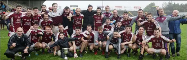  ??  ?? The St. Martin’s squad and mentors after creating a notable piece of G.A.A. history with their third successive county title in consecutiv­e grades on Saturday.