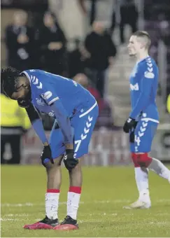  ??  ?? 0 Joe Aribo cuts a dejected figure as Rangers turned in one of their worst performanc­es of the campaign in a 1-0 Scottish Cup quarter-final defeat by Hearts at Tynecastle Park in February.