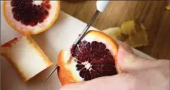  ??  ?? Removing skin from blood oranges: slice off the top and bottom for stability, then remove the sides with a sawing motion.