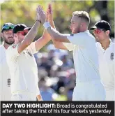  ??  ?? DAY TWO HIGHLIGHT: Broad is congratula­ted after taking the first of his four wickets yesterday