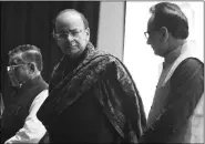  ?? Renuka Puri ?? Finance Minister Arun Jaitley with MOS for Finance Santosh Kumar Gangwar (left) and Revenue Secretary Hasmukh Adhia (right) in New Delhi on Friday.