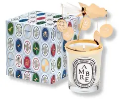  ??  ?? CAROUSSEL BY DIPTYQUE
Embellishe­d with five lucky charms that glow in the candle light, this year’s Caroussel revolves, as if by magic, when heat is released through the candle’s flame.