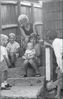  ?? COURTESY THE STONINGTON HISTORICAL SOCIETY ?? “Rose Roderick Warner and her children on Hancox Street” by Rollie McKenna