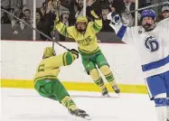  ?? Dave Stewart / Hearst Connecticu­t Media ?? Notre Dame-West Haven’s Dylan Bankowski (6) and Michael Azzarone celebrate a goal against Darien on Saturday.