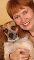  ??  ?? Elizabeth Abbott, shown with Bonzi, a rescue dog she adopted that had been trained inside a U.S. prison. Abbott is a historian who has previously written about celibacy, marriage and Haitian politics.