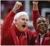  ?? (AP/Doug McSchooler) ?? Former Indiana coach Bob Knight (left) yells to the crowd Saturday during his first appearance at Assembly Hall in Bloomingto­n, Ind., since being fired by the school in September 2000.