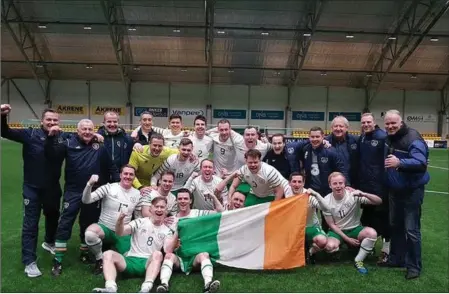  ??  ?? Ballymote’s Mark Irwin with his teammates on the Irish national Garda soccer team who beat Norway to qualify for the Euros.