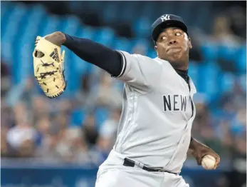  ?? CP PHOTO ?? New York Yankees pitcher Aroldis Chapman delivers to home plate during the ninth inning of Friday’s game against the Toronto Blue Jays.