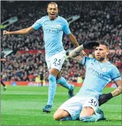  ??  ?? Manchester City's Nicolas Otamendi (R) celebrates scoring their second goal against Manchester United.