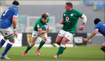  ??  ?? Tadhg Furlong stays out of Garry Ringrose’s way as his team-mate makes a break in Rome.