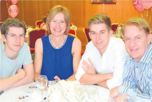  ??  ?? Much missed: Colin Millar (right) with his late wife Claire and their sons, Conor and Ryan