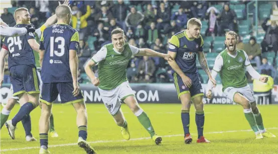  ??  ?? 2 Paul Hanlon wheels away in celebratio­n after scoring Hibs’ second in their 2-1 win over Hamilton at Easter Road last night.