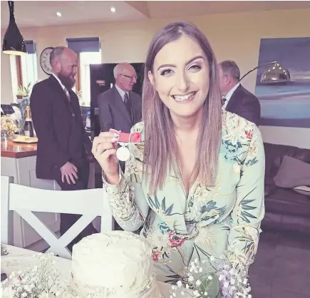  ??  ?? Emily celebratin­g her 23rd birthday at home in Orkney after receiving her British Empire Medal