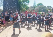  ?? Photo / NZME ?? The City of Rotorua Highland Pipe Band lead the Rotorua Christmas Parade in 2020.