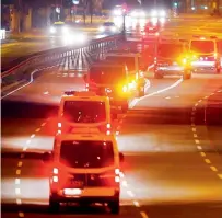  ?? AP ?? Police cars drive on a deserted street during an evacuation of more than 60 000 people in Frankfurt, Germany, on Sunday. —