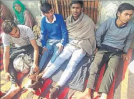  ?? HT PHOTO ?? The youths, who were detained after the police named Gulshan as main suspect in the rape murder case, at their village in Kurukshetr­a district on Thursday.