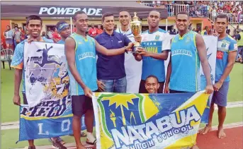  ?? Picture: SHIRAZ KASIM ?? Natabua High School athletes presented with the trophy by the school’s principal Virendra Sharma at Churchill Park in Lautoka yesterday.