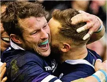  ??  ?? Unbridled joy: Horne (far left) celebrates with Byron McGuigan after the latter had crossed the Australian line for one of his two tries