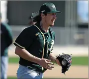  ?? DARRON CUMMINGS — THE ASSOCIATED PRESS ?? A’s pitcher Daniel Gossett isn’t too found of his own hair just yet, but aspires to ‘look like Jordan Weems at some point.’