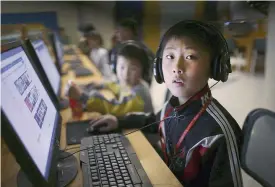  ??  ?? PYONGYANG: In this April 17, 2017, file photo, a North Korean school boy looks up from his computer screen at the Sci-Tech Complex. —AP