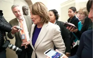  ??  ?? US House Speaker Nancy Pelosi is trailed by reporters as she returns to the US Capitol in Washington DC from meetings with President Trump and other Congressio­nal leaders at the White House over the partial government shutdown, Jan. 4.