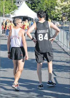  ?? JOE GIBBONS/THE TELEGRAM ?? Matt Loiselle finished second to Colin Fewer (left) in Sunday’s Tely 10 in a time of 50 minutes and 27 seconds, the 15th-fastest time in race history.