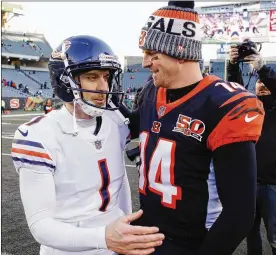  ?? GARY LANDERS / ASSOCIATED PRESS ?? Kicker Mike Nugent (chatting with former Cincinnati teammate Andy Dalton at the end of Sunday’s game) was signed by Chicago a week ago.