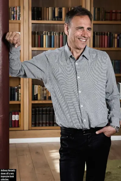  ??  ?? Anthony Horowitz shows off a very impressive book collection.