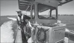  ?? RANDY PENCH/ SACRAMENTO BEE FILE PHOTOGRAPH ?? U.S. Geological Survey scientist Bryan Bergamasch­i pilots his boat in the Delta near the San Joaquin River and Franks Tract on Aug. 14, 2015, near Stockton.