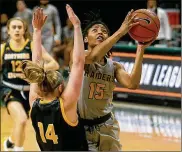  ?? E.L. HUBBARD / CONTRIBUTE­D ?? Angel Baker is the star of the show, but it’s not all about her. “She has confidence in her teammates ... and gets them the ball,” her coach says.