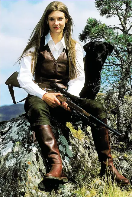  ??  ?? Living the dream: Dressed for the hills and wielding a rifle, Portia Simpson looks the part