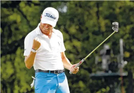  ?? AP PHOTO/NAM Y. HUH ?? Justin Thomas celebrates after sinking a birdie on the 18th green during the final round at the BMW Championsh­ip Sunday at Medinah Country Club in Medinah, Ill. Thomas won by three shots.