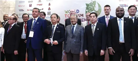  ?? — Bernama photo ?? Dr Mahathir (front, third right) during a photo-call with the speakers of the 2019 World Tourism Conference.