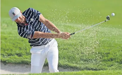  ?? AP ?? Dustin Johnson of the US plays out of a bunker on the 9th during a foursome match on the opening day of the 42nd Ryder Cup. —